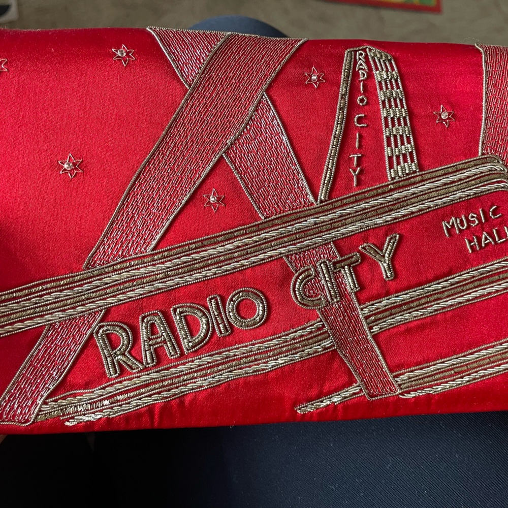 Super rare red satin Radio City clutch hand signed and numbered by Kate Spade!